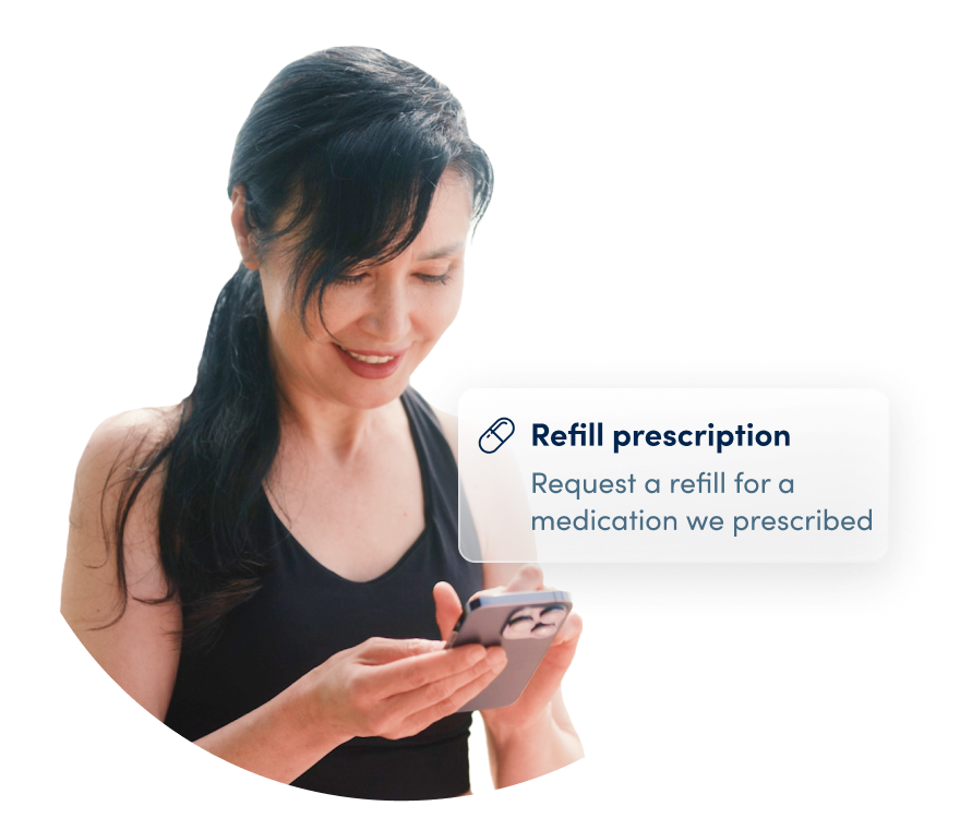 woman looking at phone refilling a prescription